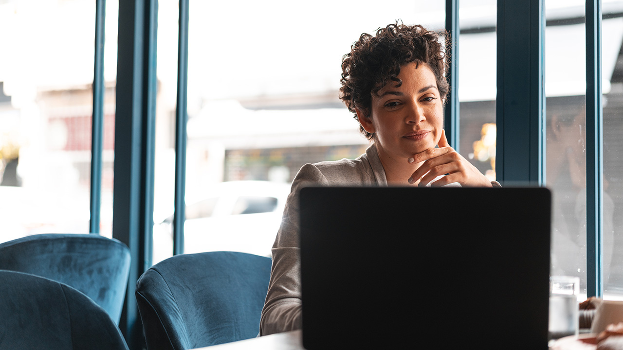 A woman checking on her laptop